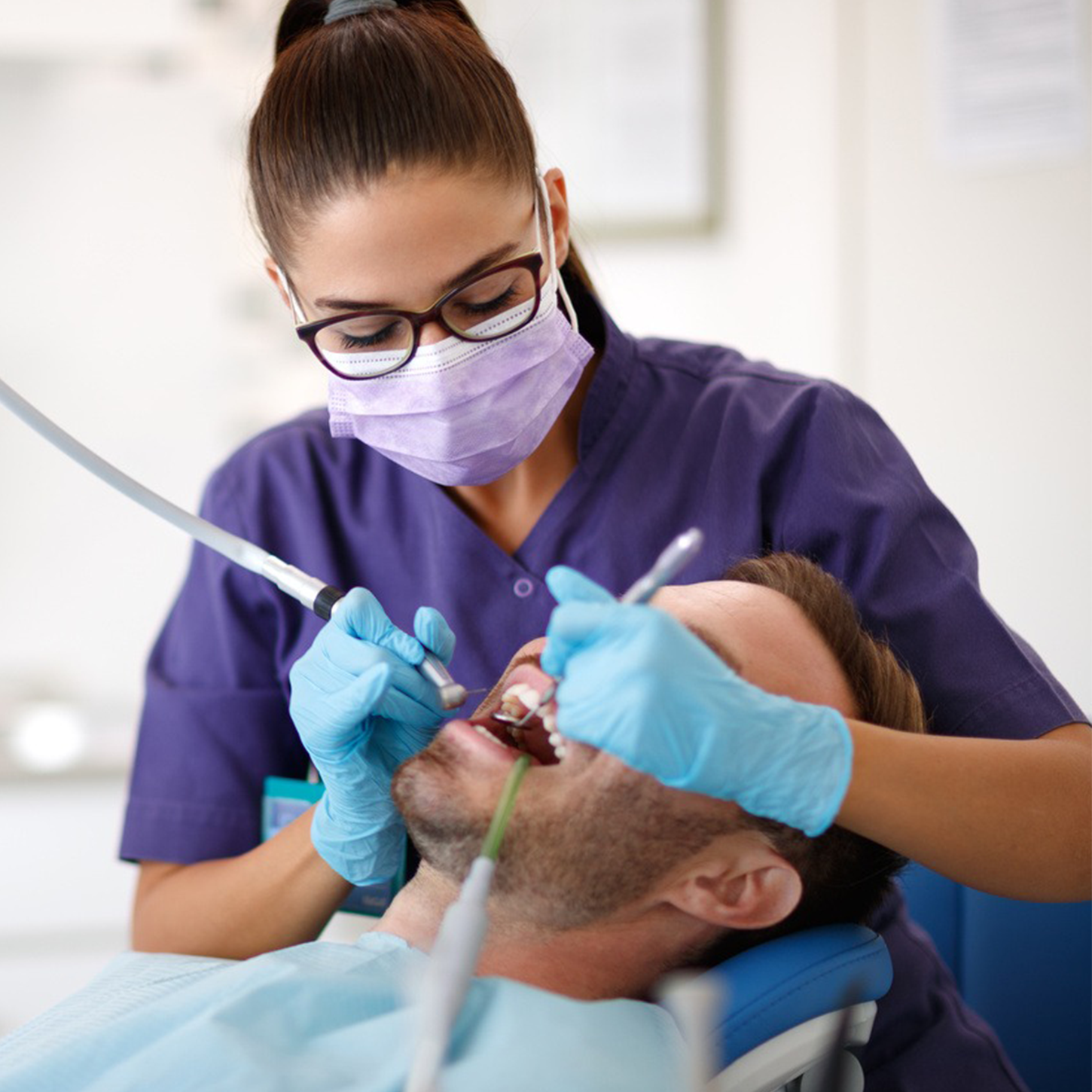 A clinician carrying out careful dental treatment